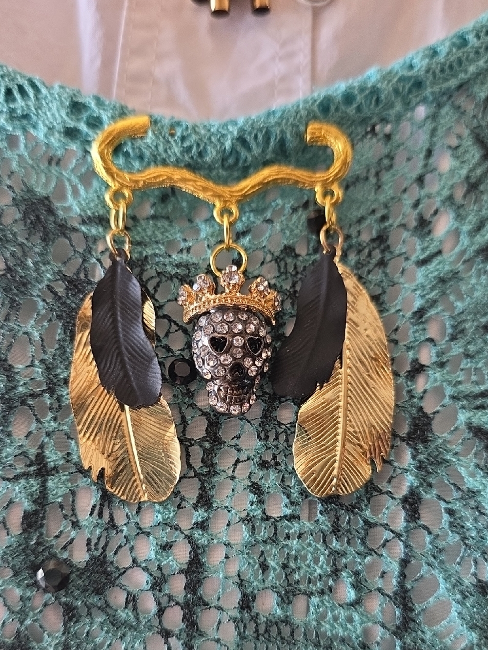 Artisian Gold and Black Skull Brooch